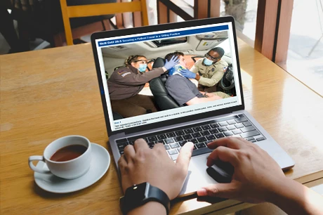 User on laptop with eLearning materials