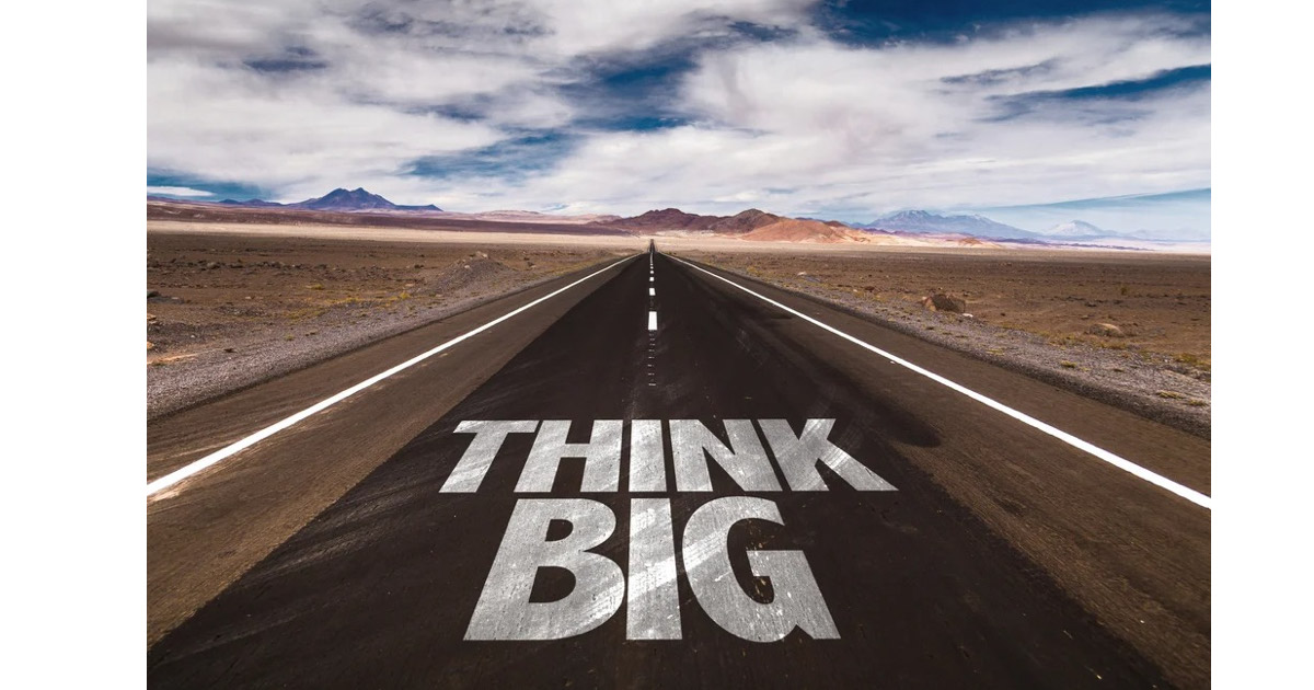 Think Big written on desert road