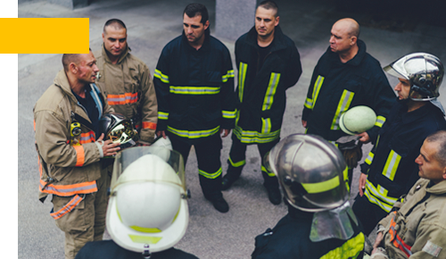 Team of firefighters listening to instructions